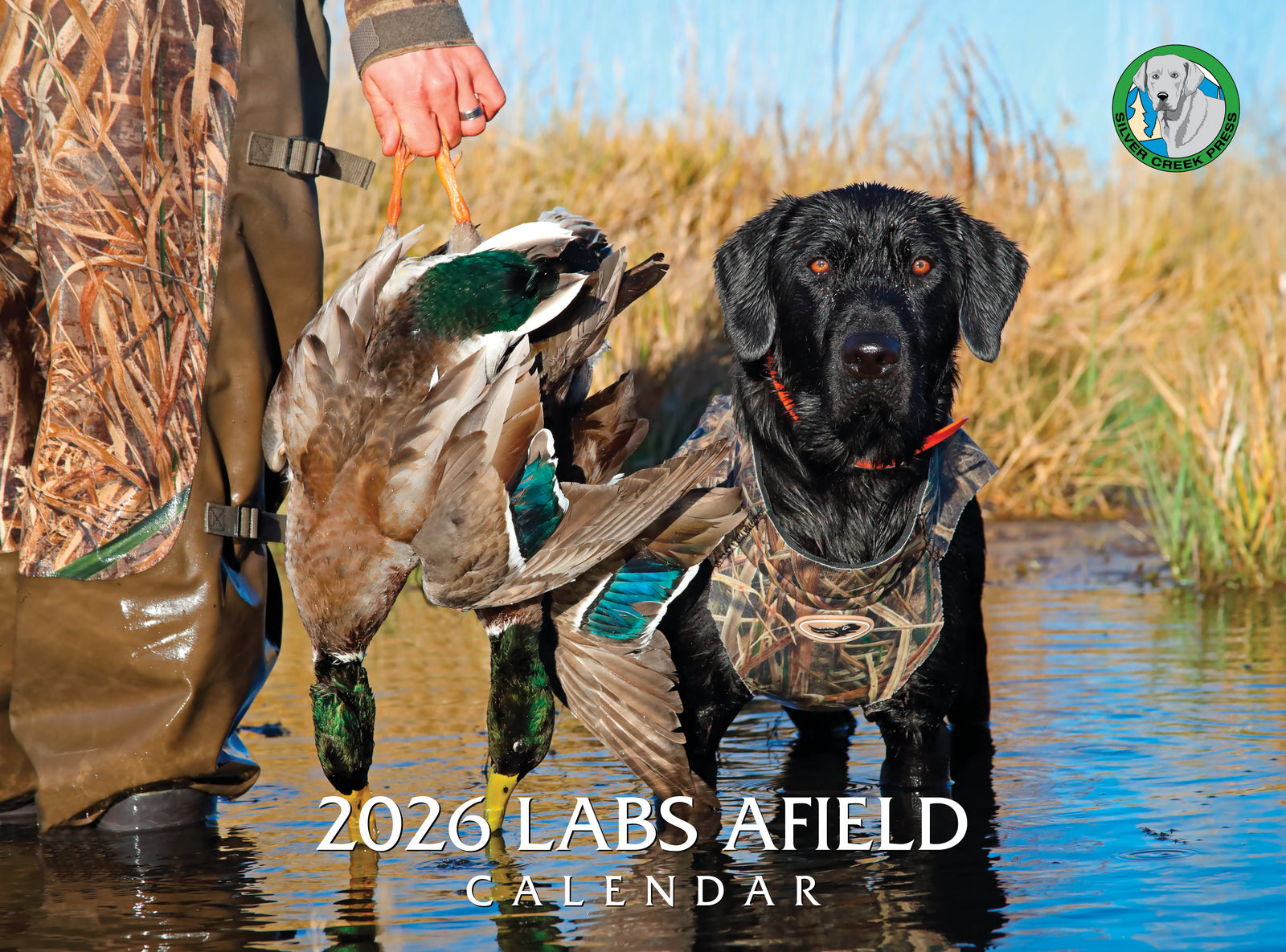 2020 Labs Afield calendar featuring a black lab with a duck in a wetland setting.