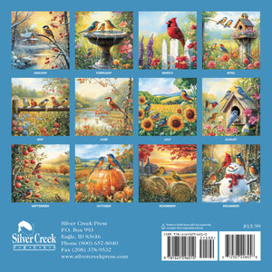 Calendar with twelve bird-themed illustrations on a blue background, featuring Silver Creek Press branding.