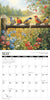 Calendar page for May with birds on a branch and flowers in the background