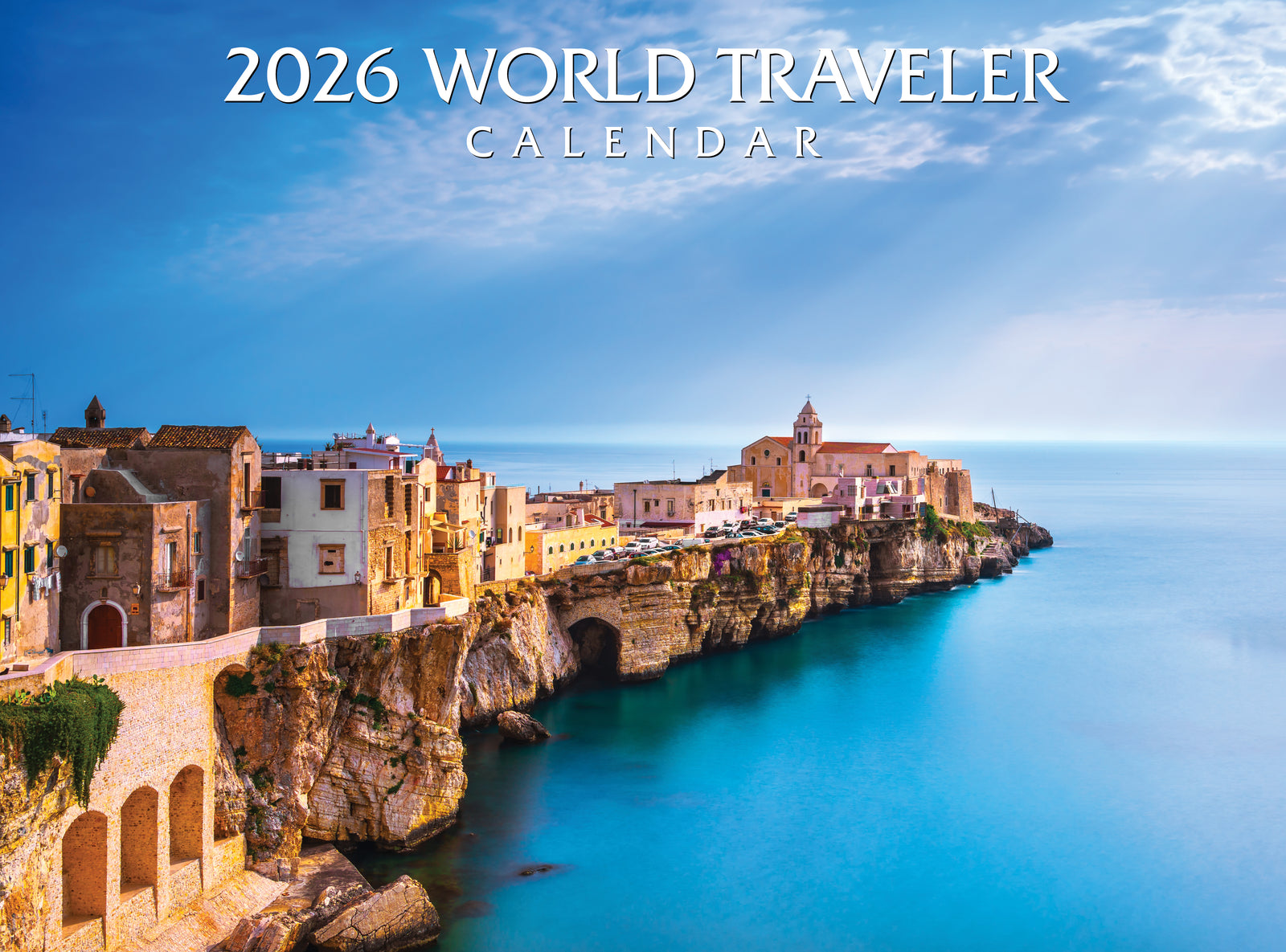 2026 World Traveler calendar with coastal town and blue sky